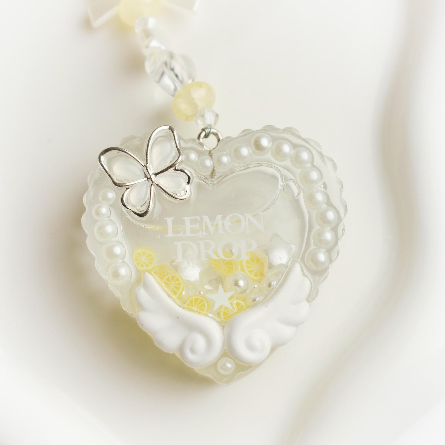 "Lemon drop" resin shaker heart